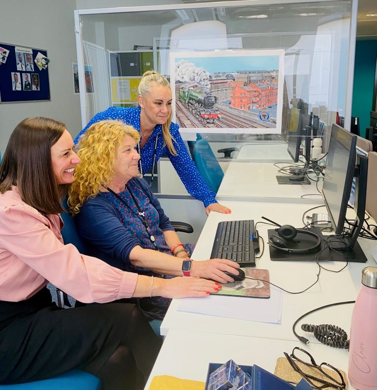 PCC with colleagues at a computer